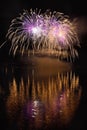 Beautiful colorful fireworks on the water surface with a clean black background. Fun festival and international contest of Firefig Royalty Free Stock Photo