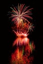 Beautiful colorful fireworks on the water surface with a clean black background. Fun festival and international contest of Firefig Royalty Free Stock Photo