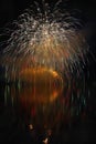 Beautiful colorful fireworks on the water surface with a clean black background. Fun festival and international contest of Firefig Royalty Free Stock Photo