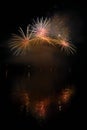 Beautiful colorful fireworks on the water surface with a clean black background. Fun festival and international contest of Firefig Royalty Free Stock Photo