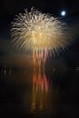 Beautiful colorful fireworks on the water surface with a clean black background. Fun festival and international contest of Firefig Royalty Free Stock Photo