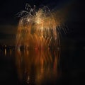 Beautiful colorful fireworks on the water surface with a clean black background. Fun festival and international contest of Firefig Royalty Free Stock Photo