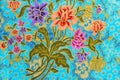 Beautiful colorful flowers on batik background Royalty Free Stock Photo