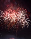 Beautiful colorful holiday fireworks on the black sky background, long exposure Royalty Free Stock Photo