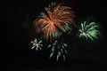 Beautiful colorful holiday fireworks on the black sky background, long exposure Royalty Free Stock Photo