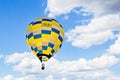 Beautiful colorful hot air balloon in flight over the blue sky Royalty Free Stock Photo