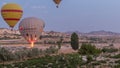 Beautiful colorful hot air balloons take off and flying in clear morning sky timelapse in Cappadocia, Turkey Royalty Free Stock Photo