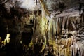 Beautiful colorful and illuminated cave with stalactites and stalagmites