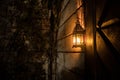 Beautiful colorful illuminated lamp in the garden in misty night. Retro style lantern at night outdoor