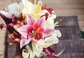 beautiful colorful lily flower bouquet on rustic wooden background. gorgeous bloom lilies on rustic wood backdrop. space for text Royalty Free Stock Photo