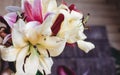 beautiful colorful lily flower bouquet on rustic wooden background. gorgeous bloom lilies on rustic wood backdrop. space for text Royalty Free Stock Photo