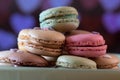 Beautiful Colorful macarons on black background, close up view