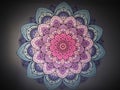 Beautiful colorful mandala on a dark gray background.