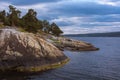 Beautiful colorful Norwegian seascape with trees and rocky coast Royalty Free Stock Photo