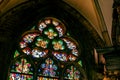 Beautiful colorful old antique stained glass window inside a church, cathedral, multi colored stained glass art up close, nobody, Royalty Free Stock Photo