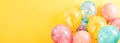 Beautiful colorful pastel balloons with on yellow background for party, birthday, celebration banner. Luxury festive Royalty Free Stock Photo