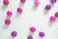 Beautiful colorful pink and purple Christmas balls pattern on a light grey background with copy space. Flat lay minimal design. Royalty Free Stock Photo