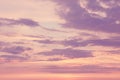 Beautiful colorful pink purple clouds on yellow sky at sunset or sunrise. Evening or morning pastel colors sky natural eco Royalty Free Stock Photo