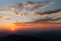 Beautiful colorful red sunset on mountains in the evening