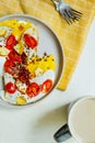 Beautiful colorful simple homemade breakfast of fried eggs with egg yolk, cheese, tomatoes, paprika and coffee. vegan breakfast