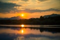 A beautiful, colorful sunset landscape with lake, mountain and forest. Natural evening scenery over the mountain lake in summer. Royalty Free Stock Photo