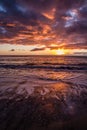 Beautiful Colorful Sunset Over Beach with Clouds Royalty Free Stock Photo
