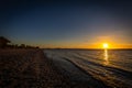 Beautiful colorful sunset over the beach of lake Neusiedler in Podersdorf