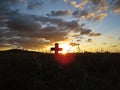 Beautiful Colorful Sunset Over Cross on Churchyard Cemetery Graveyard