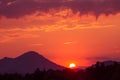 A beautiful, colorful sunset over the mountains, lake and forest in purple tones. Abstract, bright landscape. Royalty Free Stock Photo