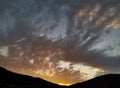 Beautiful colorful sunset sky above hill tops of the Velebit mountain