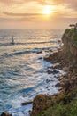 Beautiful colorful sunset and vivid dramatic sky at rocky shore of the Atlantic ocean