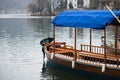 Beautiful colorful traditional rowing wooden boat pletna on pure lake bled