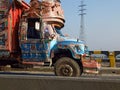 A beautiful and colorful truck on the road. Truck art in Pakistan.