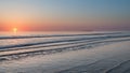 Beautiful colorful vibrant sunrise over low tide beach landscape