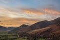 Beautiful colorful Winter sunset landscape over Skiddaw range looking towards Bassenthwaite Lake in Lake District Royalty Free Stock Photo