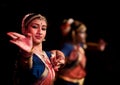 A beautiful and colorfully dressed Bharathanatyam dancers performing at ADA Rangamandira