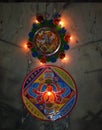 Beautiful colour mat rangoli with oil lamps , Diwali deepawali festival , India