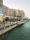 The beautiful coloured buildings of Qanat Quartier on the artificial island of The Pearl, Qatar