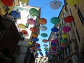 Beautiful coloured umbrellas over the city of Genova