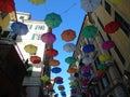 Beautiful coloured umbrellas over the city of Genova