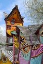 Beautiful Coloured Wooden Houses Used as Baby Climbing Frames - Playing Area