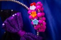 Beautiful and colourful hair clips, bracelet for kids and teens on a blue background