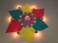 Beautiful colourful Rangoli design with diyas for Diwali Festival Royalty Free Stock Photo