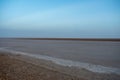 Beautiful colourful sunset over endless empty road in middle of desert. Asphalt highway in Tunisia, North Africa. Royalty Free Stock Photo