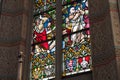 A beautiful, colourful window of leaded glass in a church with with biblical motives