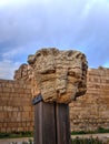 Beautiful Column capital representing a lion head original from Roman times in Cesarea Israel