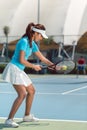 Beautiful and competitive woman smiling before starting the match Royalty Free Stock Photo