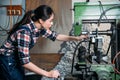 Factory female staff using technology machine