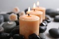 Beautiful composition with candles and spa stones Royalty Free Stock Photo