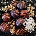 A beautiful composition of Christmas tree decorations and balls, golden twigs and black sequins. New Year and Christmas background